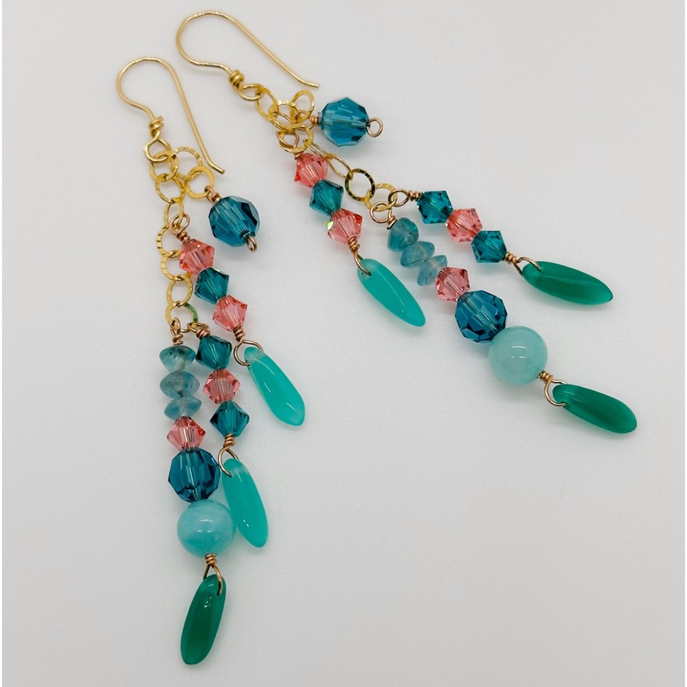 Handmade earrings made with beads, Swarovski crystals and stones.